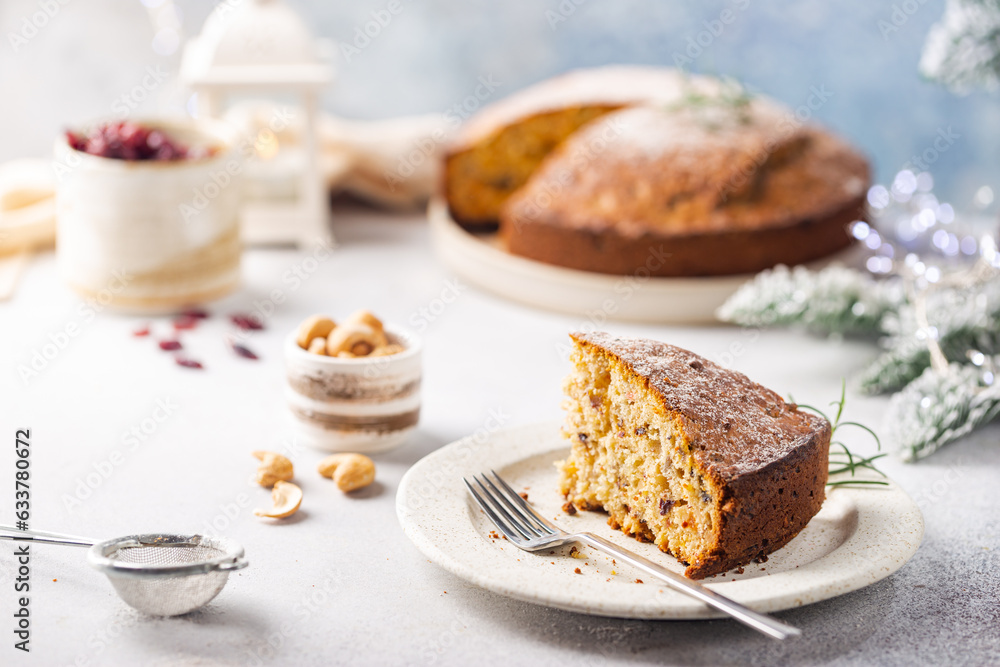 Traditional Christmas cake pudding with fruits and nuts with Christmas decorations, light background Traditional Christmas cake pudding with fruits and nuts with Christmas decorations, light background