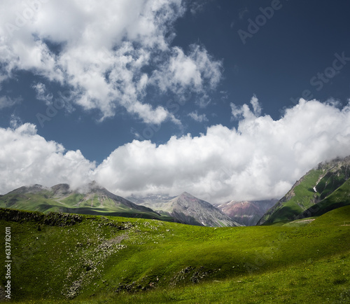 Mountain landscape. Clouds over the green mountains.