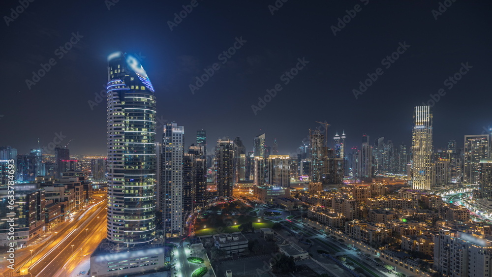 Panorama showing Dubai Downtown and business bay night with tallest skyscraper and other towers