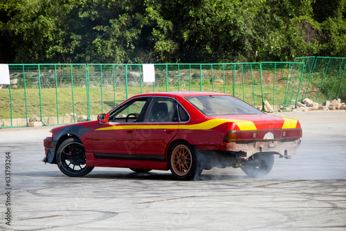 drift  red car with yellow stripes  black wheels