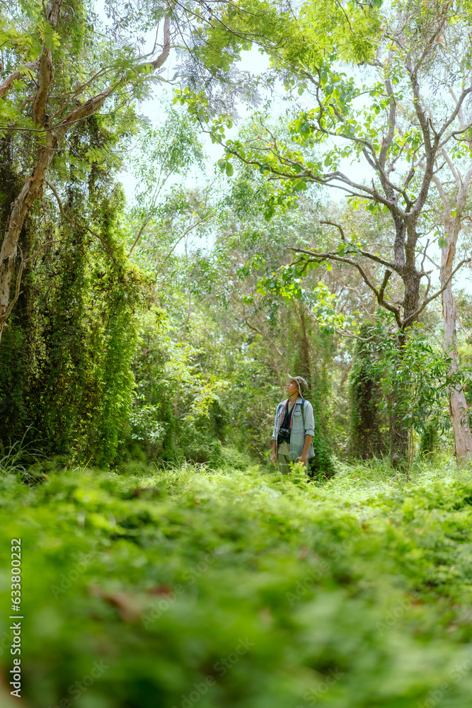 Asian man traveling hiking taking photos alone Asian man traveling hiking taking photos alone