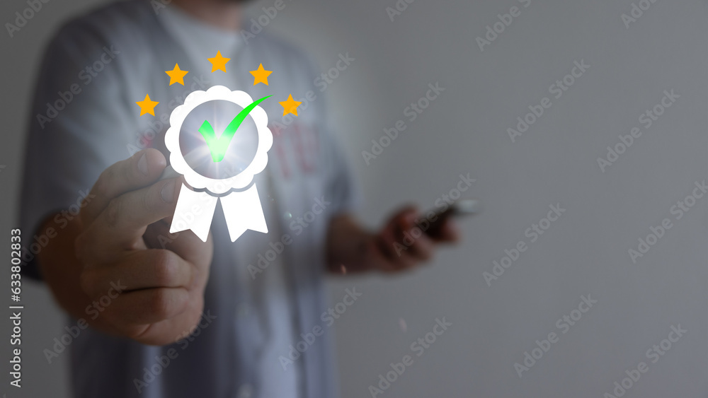 Quality assurance of business services, Businessman Hand shows the sign of the top service Quality assurance in Black background , Guarantee, Standards, ISO certification and standardization concept. Quality assurance of business services, Businessman Hand shows the sign of the top service Quality assurance in Black background , Guarantee, Standards, ISO certification and standardization concept.