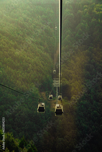 view of cable car in the mountains at golden hour
