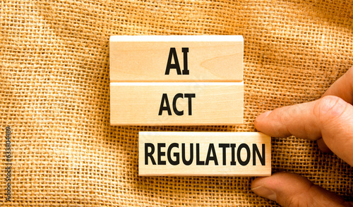 AI act regulation symbol. Concept words AI artificial intelligence act regulation on wooden block. Beautiful canvas background. Businessman hand. Business AI act regulation concept Copy space photo