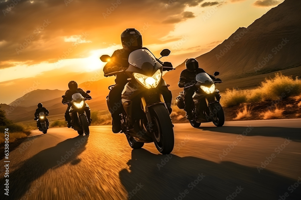 Group of young bikers man riding speed motorcycle on empty motion road against beautiful golden sunset with dusky sky. Motorbike sports riding fast and having fun driving.