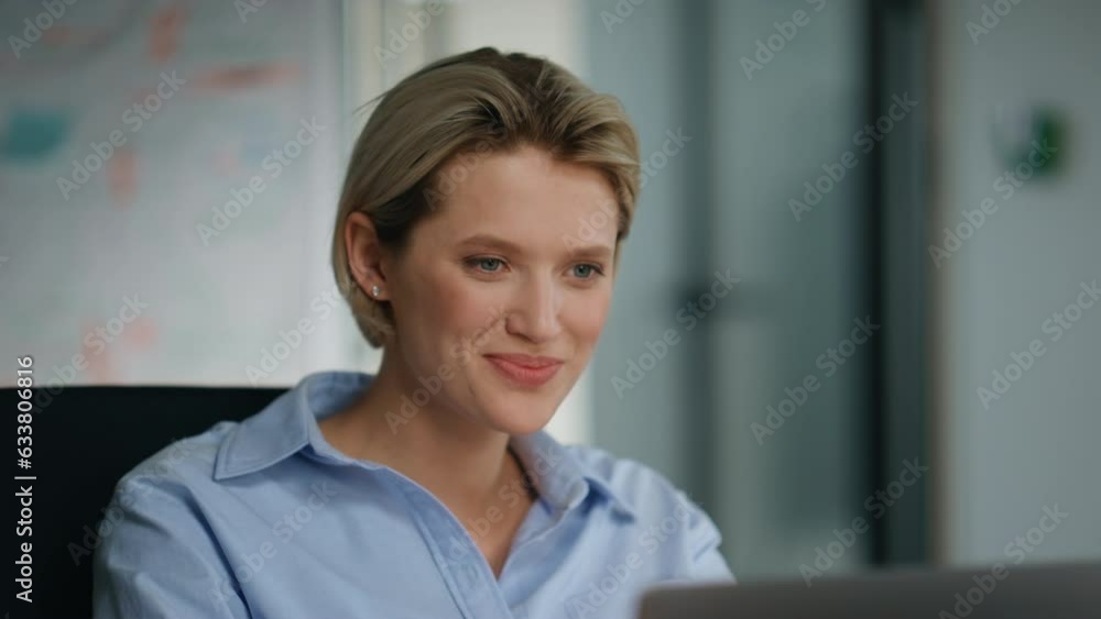 Attractive businesswoman saying hello to unknown colleagues at workplace closeup Attractive businesswoman saying hello to unknown colleagues at workplace closeup