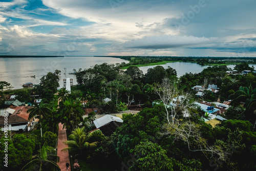 Puerto Narino Time Lapse Colombia Tropical Landscape Skyline Amazon River Shore, Blue Sky, Clouds in Motion and Boats photo