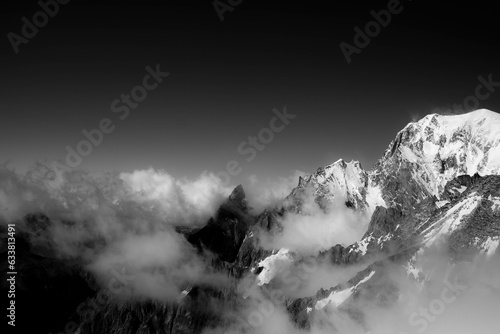 the snow-covered Mont Blanc mountain range photographed in black and white in July 2023