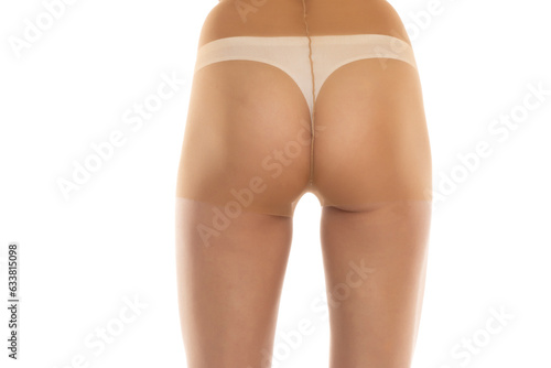 Woman wearing tights isolated on white, closeup of legs on a white background. Back, rear view