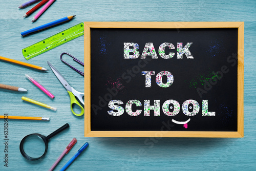 Back to School. Chalk writing on blackboard. The concept of beginning of school year. First day of preschool. Welcome inscription. photo