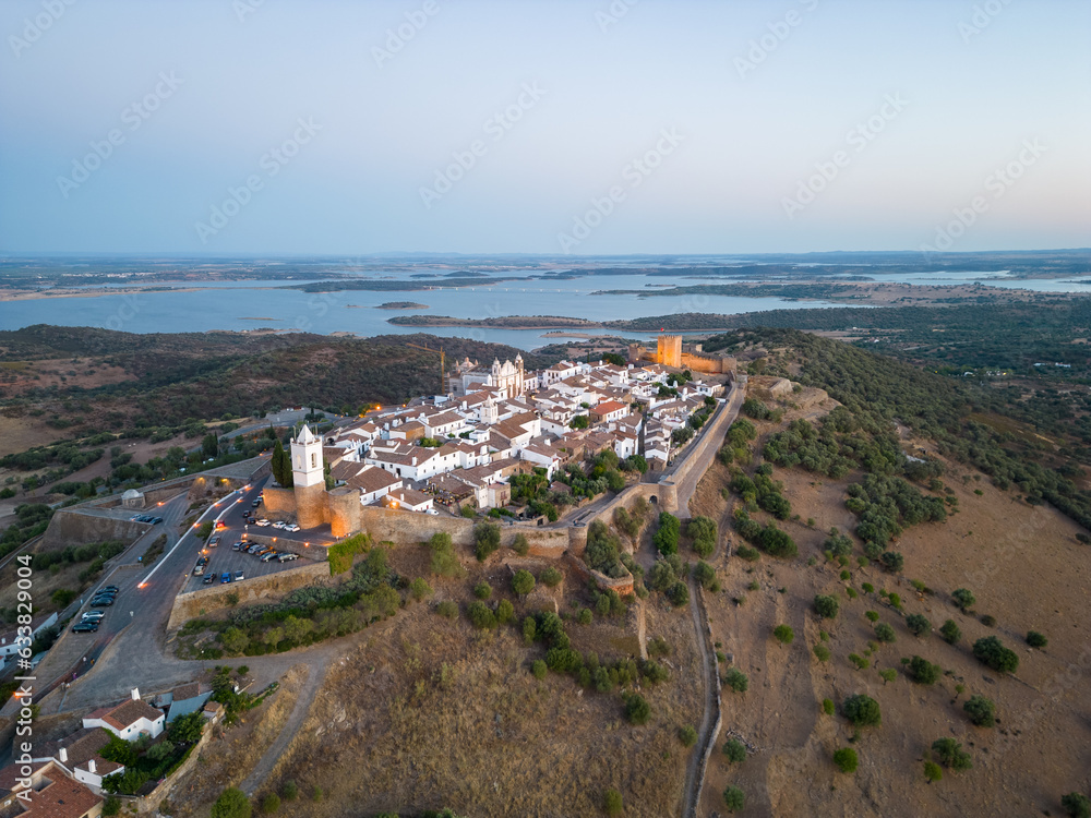 Fototapeta premium Aerial view of the Monsaraz Castle on a hill at sunset, Portugal
