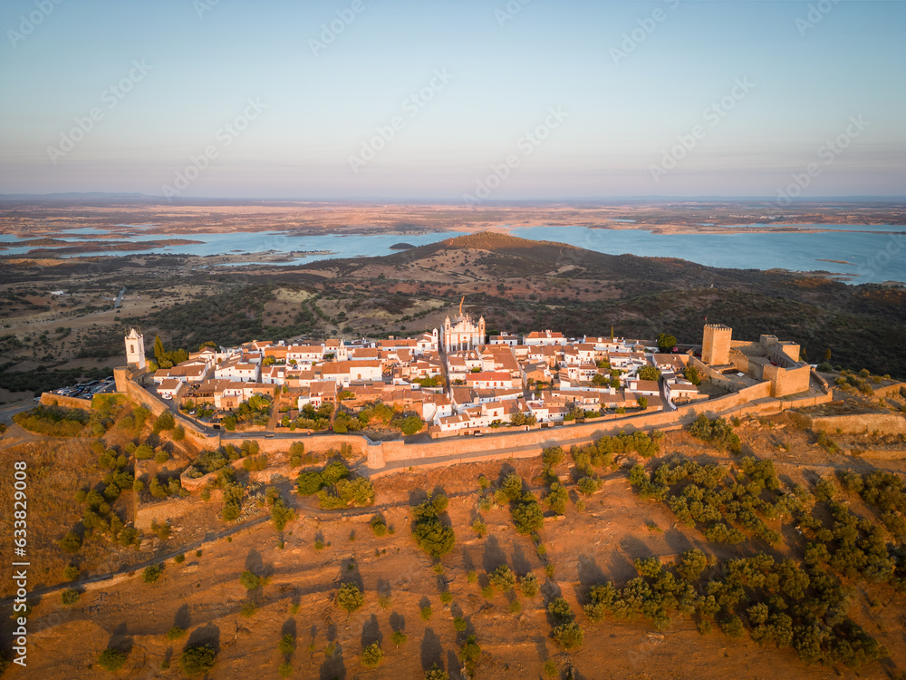 Obraz premium Aerial view of the Monsaraz Castle on a hill at sunset, Portugal