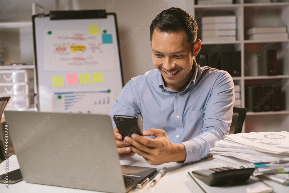 Young Asian businessman talking on the phone
late night hustle ambitious Working overtime talking on the phone in the organization Young Asian businessman talking on the phone
late night hustle ambitious Working overtime talking on the phone in the organization