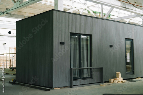 Exhibition of new and modern prefabricated modular house from composite wood panels. Energy efficient panel assembling