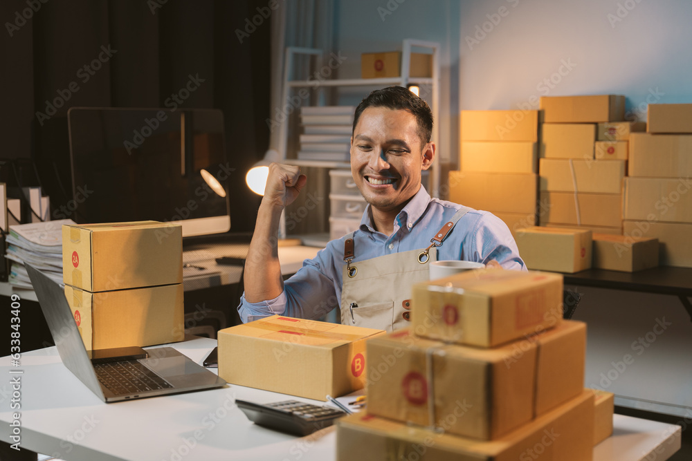 Asian Male Small Business Owner Using Mobile App On Smartphone Checking asian-male-small-business-owner-using-mobile-app-on-smartphone-checking