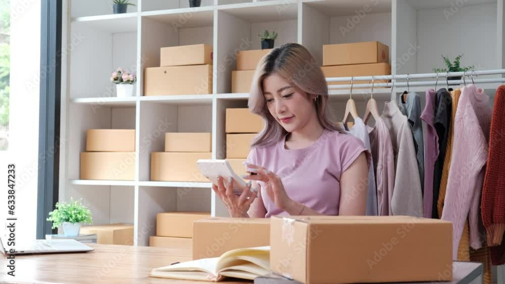 Happy business owner sell online making marketing sell on internet entrepreneur calculate on calculator for price finance cash value Happy business owner sell online making marketing sell on internet entrepreneur calculate on calculator for price finance cash value