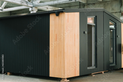 Exhibition of new and modern prefabricated modular house from composite wood panels. Energy efficient panel assembling