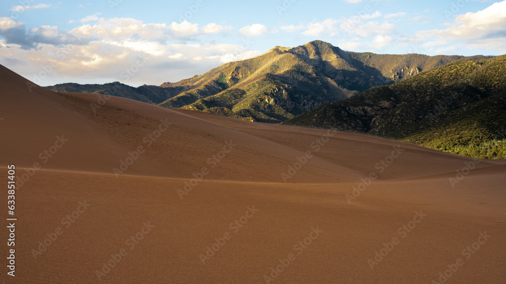 desert with cloudy sky during sunset