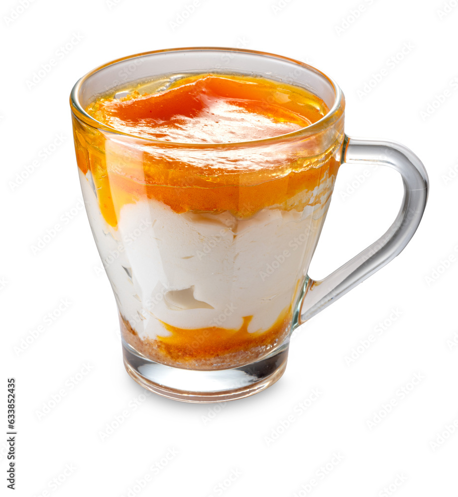 Ice cream semifreddo dessert with apricot flavored mousse in glass cup isolated Ice cream semifreddo dessert with apricot flavored mousse in glass cup isolated