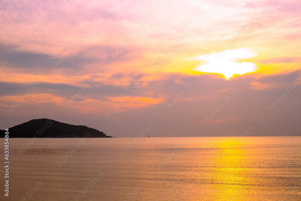 Seascape. Sunset on the sea coast. Beautiful sky and orange reflection on the sea surface of the water. Travel and tourism. Wallpaper