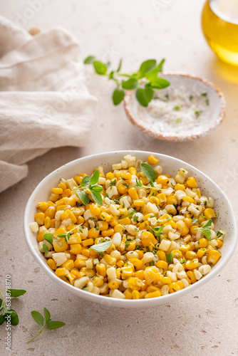 Sauteed yellow and white corn with herbs, healthy side dish idea