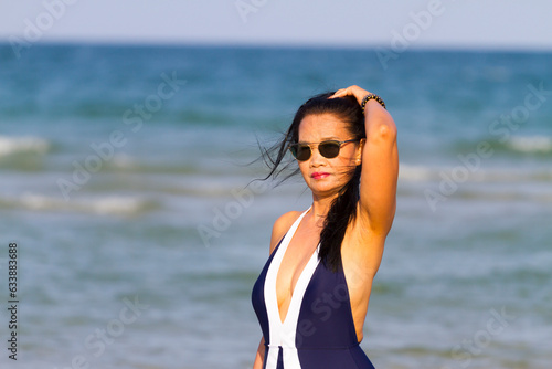 Woman body beautiful with bikini relax on beach