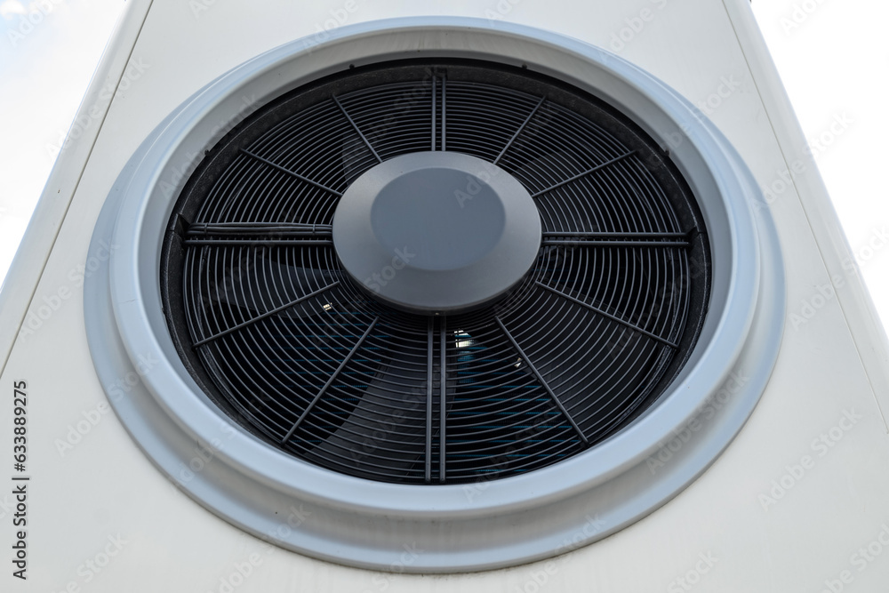 Close-up shot of a heat pump fan for solar systems on the roof Close-up shot of a heat pump fan for solar systems on the roof