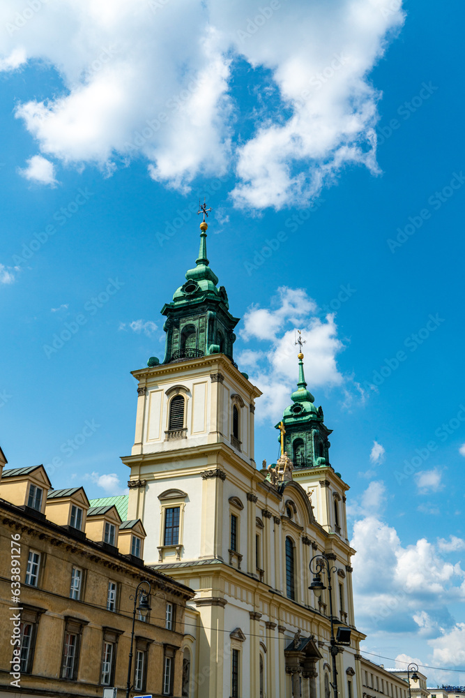 Shot of the copper roof and bell towers at the Holy Cross Church in Warsaw
