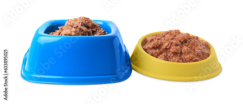 Wet pet food in feeding bowls on white background