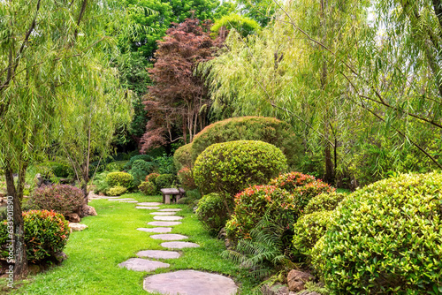 Photography Stone stepping Walkway among lawn in a Japanese style garden.