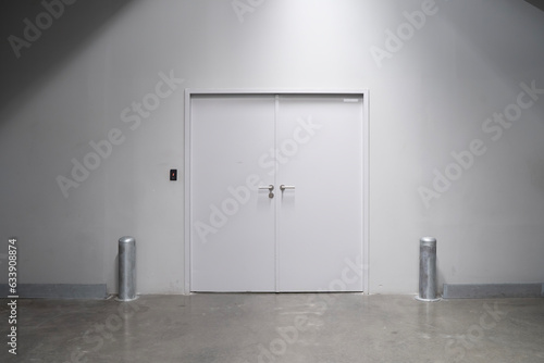 Closed White Doors to Stockroom with Fingerprint Scanner