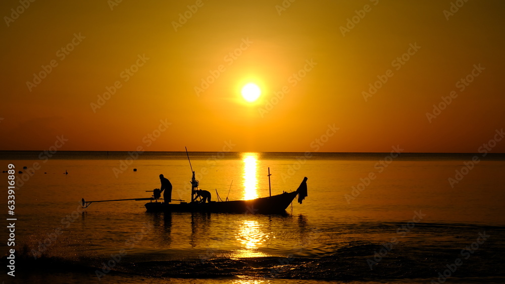 picture of sunrise at the beach and fishermen working in the morning Marine photographs on fishing documentaries.