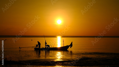 picture of sunrise at the beach and fishermen working in the morning Marine photographs on fishing documentaries.