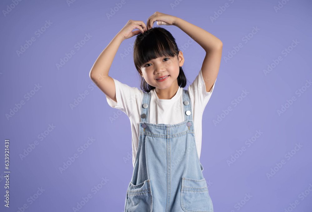 cute asian girl posing on purple background cute asian girl posing on purple background