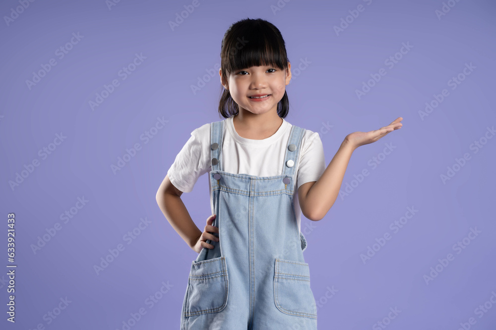 cute asian girl posing on purple background cute asian girl posing on purple background