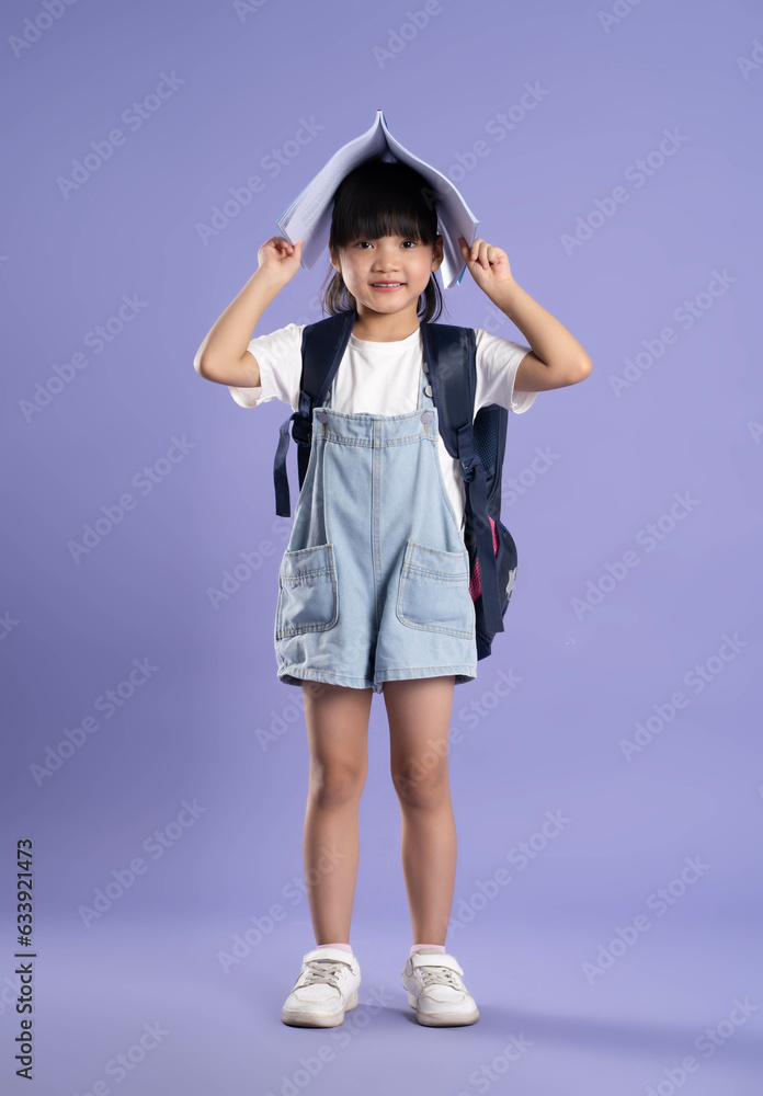 full body cute asian girl posing on purple background