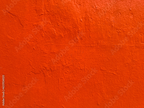 Red-orange stucco texture background in Oaxaca, Mexico
