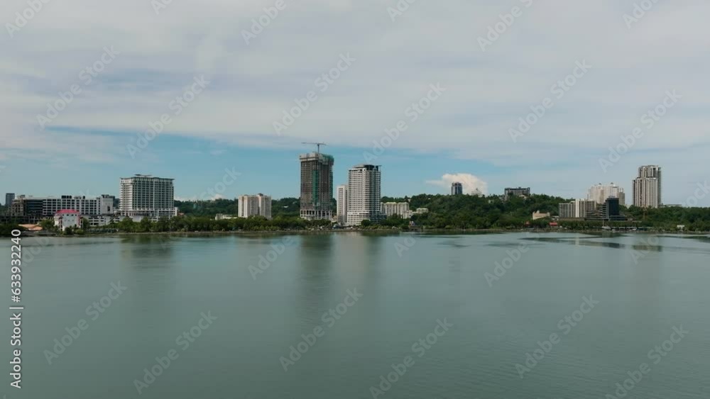 Aerial drone of the city of Kota Kinabalu from the sea. Borneo, Sabah, Malaysia. Aerial drone of the city of Kota Kinabalu from the sea. Borneo, Sabah, Malaysia.