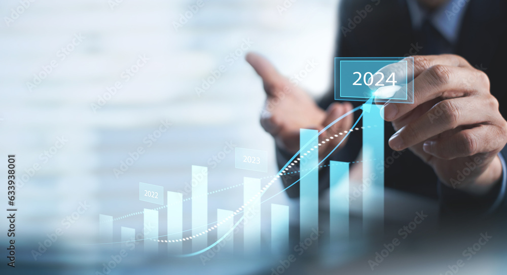 Businessman touching on business growth graph for year 2023 to 2024. new business goals, plans and strategy. Business Development concept - obrazy, fototapety, plakaty 