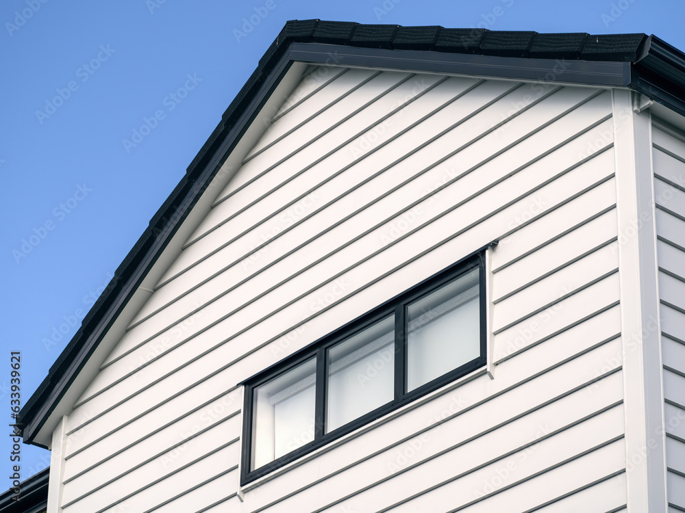 First floor of modern townhouse. Exterior view. Gable roof. First floor of modern townhouse. Exterior view. Gable roof.