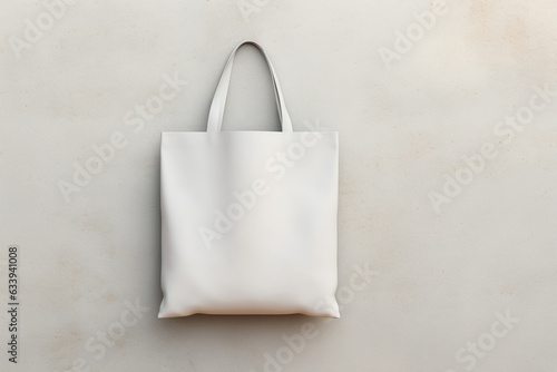 design mockup: black white shopping toat bag on a blank plaster wall photo