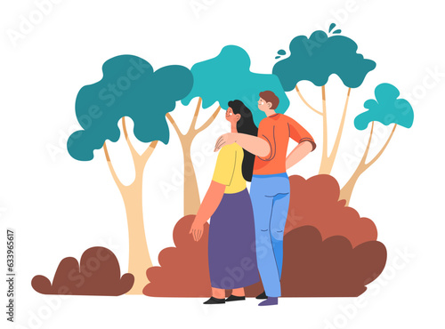 Couple strolling in woods, forest or park walking