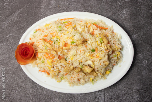 Chicken Fried Rice with egg and vegetables served in dish isolated on background top view of bangladesh food