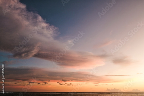  Cotton stratocumulus clouds with the glare of sunset background. Beautiful landscape, it is suitable for background and wallpapper.  photo