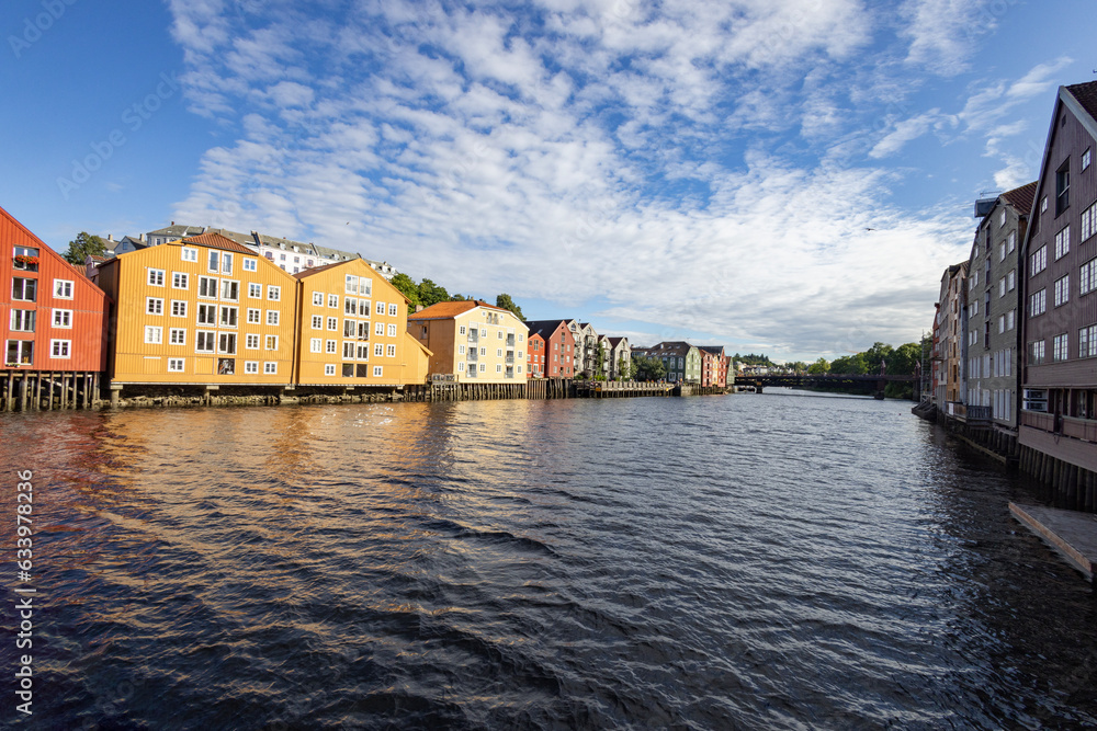 Wandering the banks of the Nidel river in Trondheim city, with old sea houses, Trøndelag, Norway
