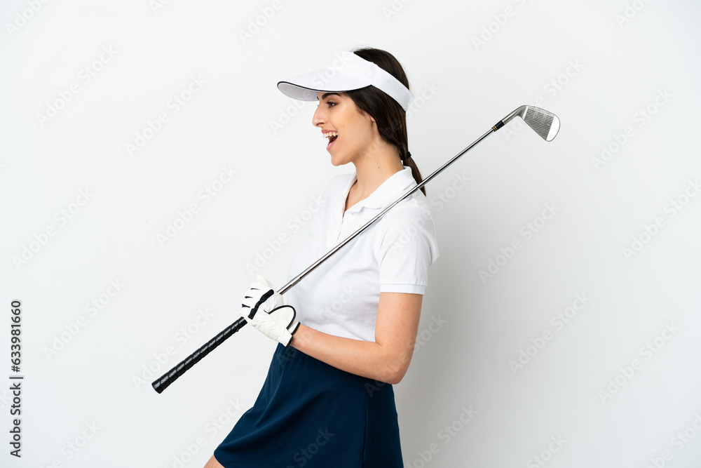 Handsome young golfer player woman isolated on white background laughing in lateral position Handsome young golfer player woman isolated on white background laughing in lateral position
