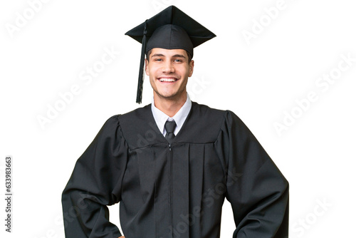 Young university graduate caucasian man over isolated background posing with arms at hip and smiling