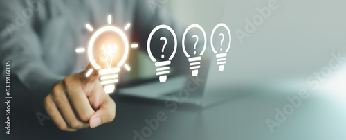 Принти на полотні Close up hand choose light bulb or lamp with bright for human resources or leadership and creativity thinking idea motivation or vision and knowledge learning