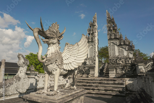 Lembuswana statue, mythological animal who has head of lion with crown, elephant trunk, fish scales, and eagle wings in a temple Pulau Kumala (Kumala Island), Tenggarong, Kutai Kartanegara, Indonesia. photo