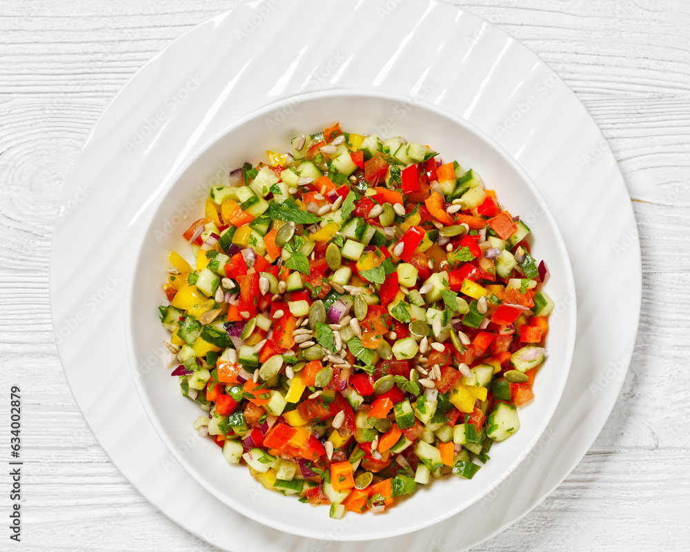 Israeli salad of finely diced veggies in bowl Israeli salad of finely diced veggies in bowl